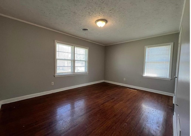 unfurnished room with crown molding, dark hardwood / wood-style flooring, and a textured ceiling