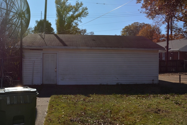 garage featuring a lawn