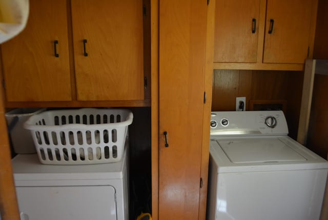 laundry room with hookup for a washing machine and cabinets