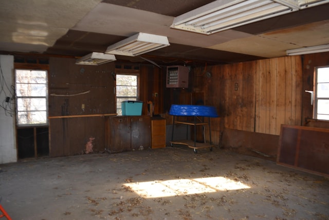 miscellaneous room with wood walls