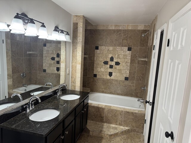 bathroom featuring vanity and tiled shower / bath combo