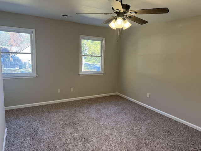 carpeted empty room featuring ceiling fan