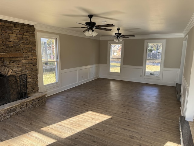 unfurnished living room featuring a fireplace, dark hardwood / wood-style floors, and ornamental molding