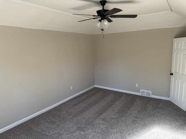 carpeted spare room with ceiling fan and lofted ceiling