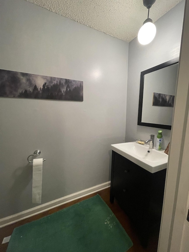 bathroom featuring vanity and a textured ceiling