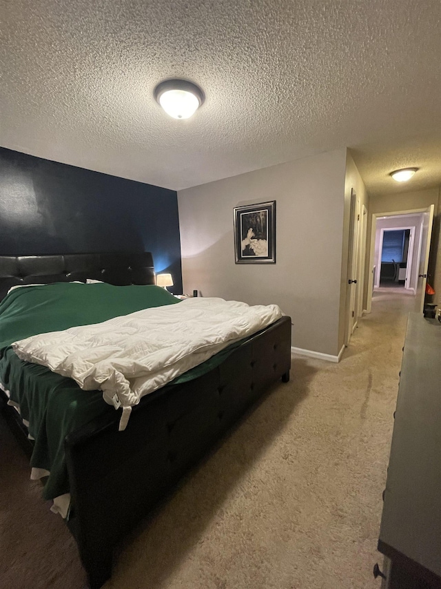 carpeted bedroom with a textured ceiling