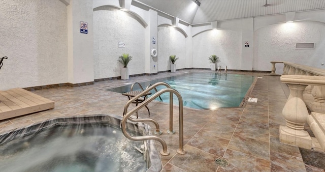 view of pool with sink and a jacuzzi