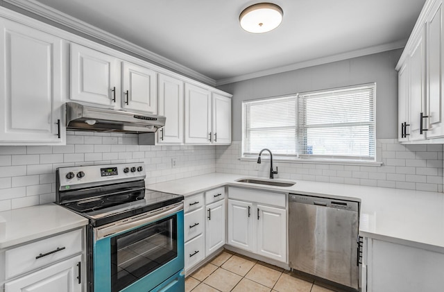 kitchen featuring white cabinetry, sink, appliances with stainless steel finishes, light tile patterned flooring, and ornamental molding