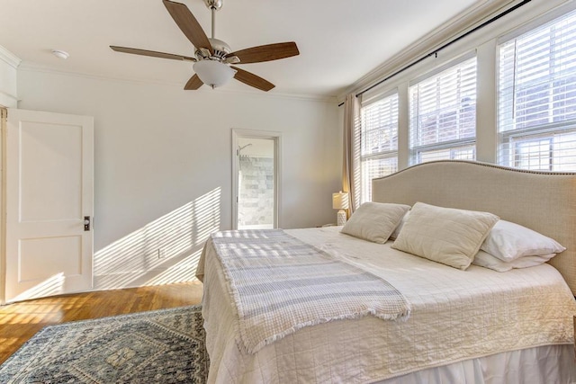 bedroom featuring wood-type flooring, ceiling fan, and ornamental molding