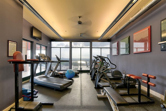 exercise room with ceiling fan