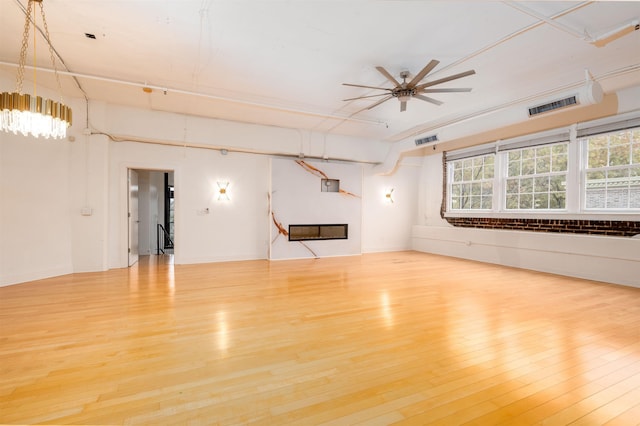 spare room featuring wood-type flooring and ceiling fan