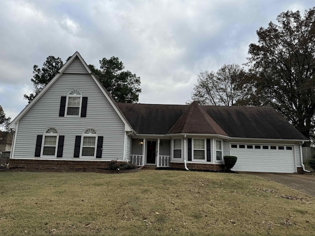 view of front of home featuring a garage and a front yard