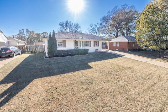 ranch-style house with a front lawn