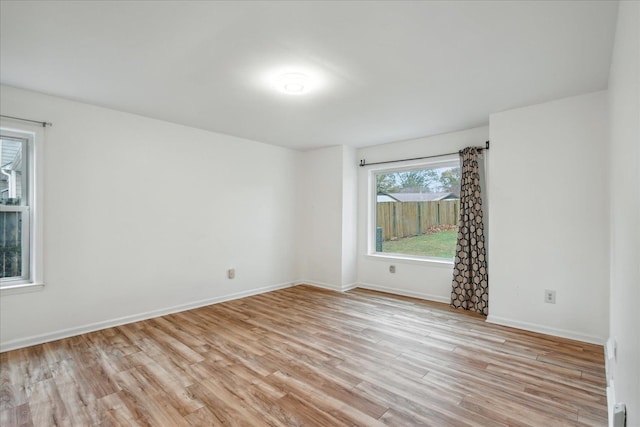 spare room with light hardwood / wood-style flooring