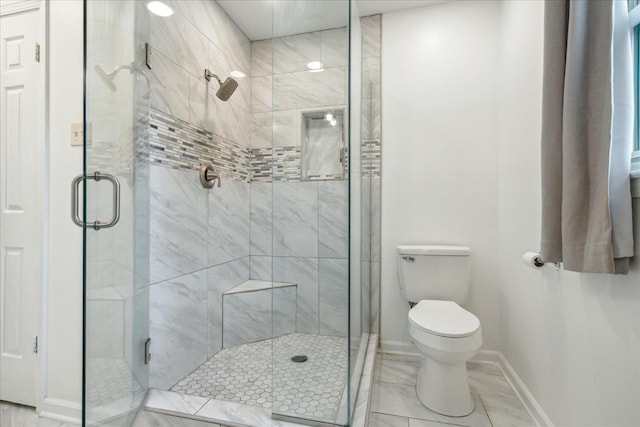 bathroom with toilet and walk in shower