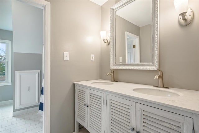 bathroom with tile patterned flooring and vanity