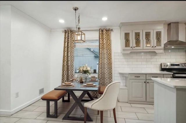 dining area with crown molding