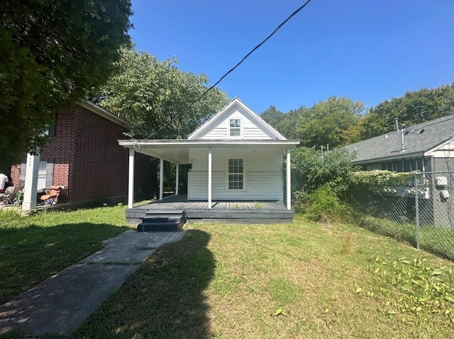 view of front facade with covered porch and a front lawn