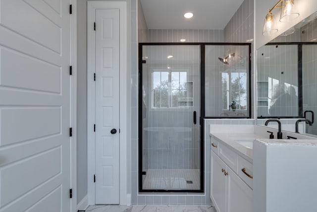 bathroom with vanity and walk in shower