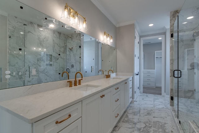 bathroom with crown molding, vanity, and an enclosed shower