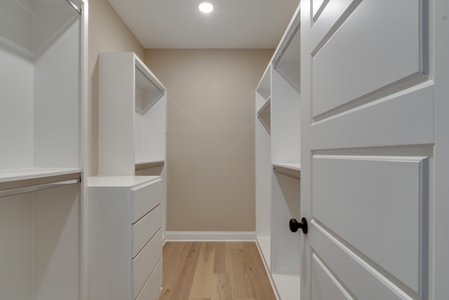 walk in closet featuring light hardwood / wood-style floors