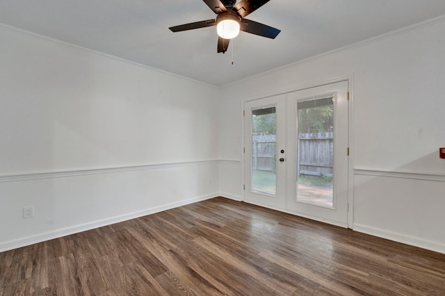 empty room featuring dark hardwood / wood-style flooring, ceiling fan, french doors, and ornamental molding