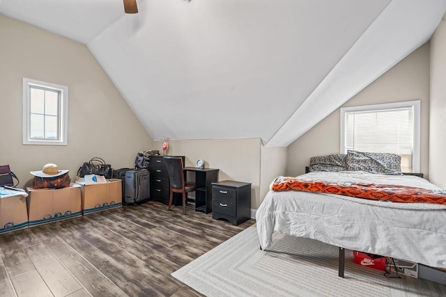 bedroom featuring ceiling fan, dark wood-type flooring, and vaulted ceiling