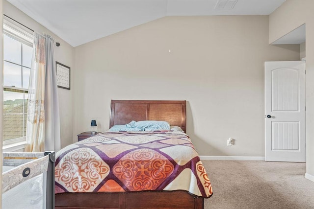 carpeted bedroom with vaulted ceiling