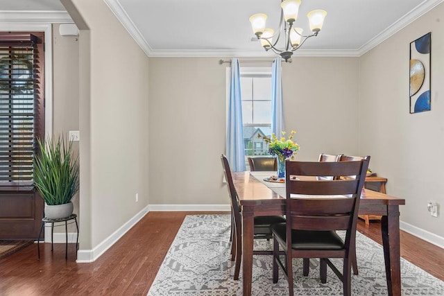 dining room with a notable chandelier, dark hardwood / wood-style floors, and crown molding