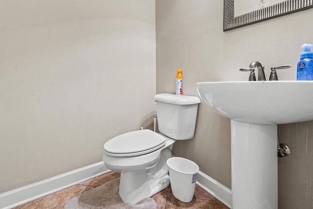 bathroom with tile patterned flooring and toilet