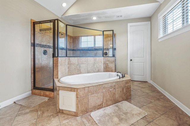 bathroom featuring tile patterned floors, plenty of natural light, and independent shower and bath