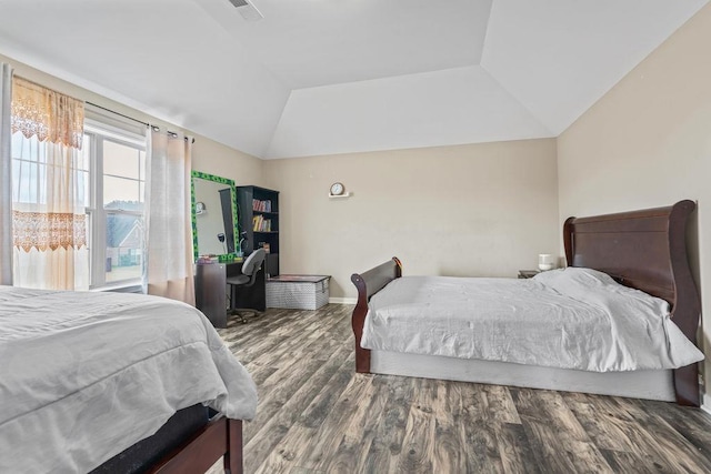 bedroom featuring dark hardwood / wood-style flooring and lofted ceiling