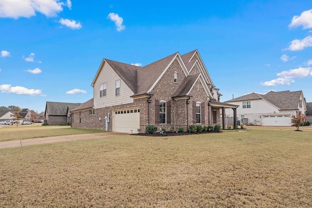 view of front of house with a garage and a front lawn