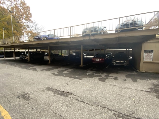 view of parking / parking lot with a carport