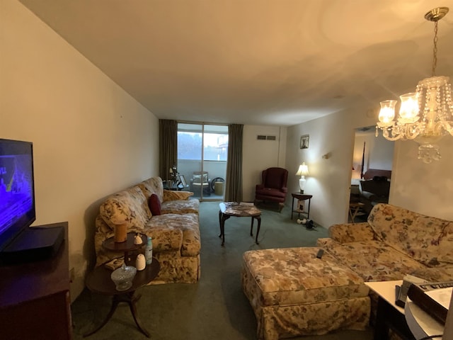 carpeted living room with a notable chandelier