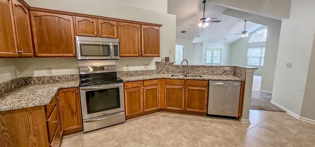 kitchen featuring high vaulted ceiling, sink, ceiling fan, light tile patterned floors, and appliances with stainless steel finishes