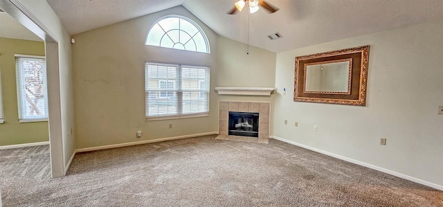 unfurnished living room with carpet, ceiling fan, and vaulted ceiling