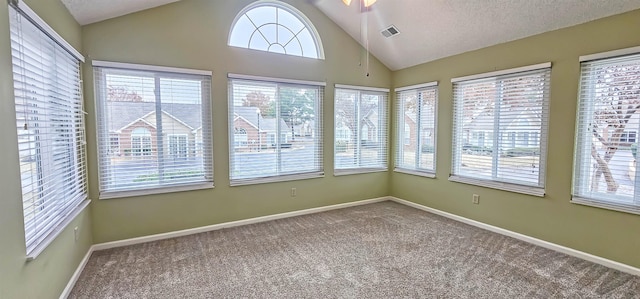 unfurnished sunroom with ceiling fan and lofted ceiling