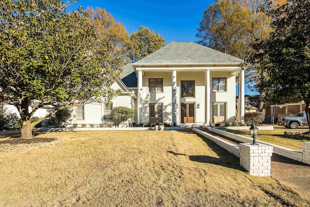 view of front facade with a porch and a front yard