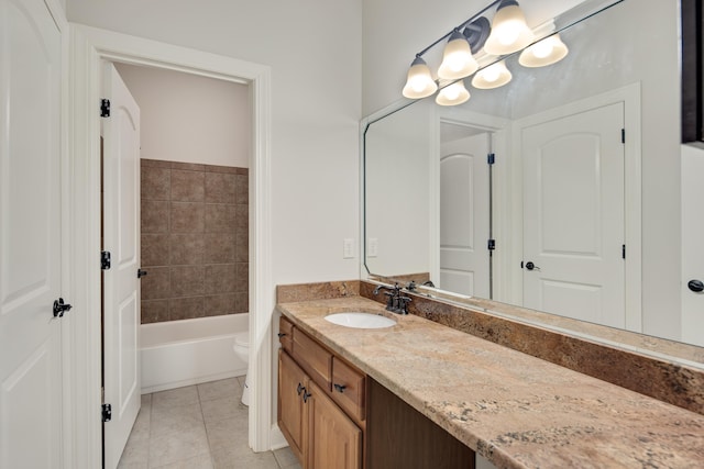 full bathroom featuring toilet, vanity, tile patterned floors, and tiled shower / bath combo