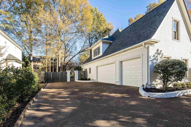 view of side of home with a garage