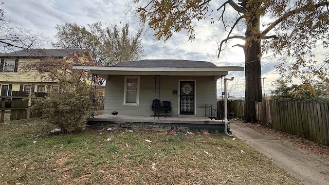 view of front of property with a porch and a front yard