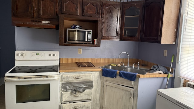 kitchen featuring white range with electric stovetop, dark brown cabinets, sink, and range hood