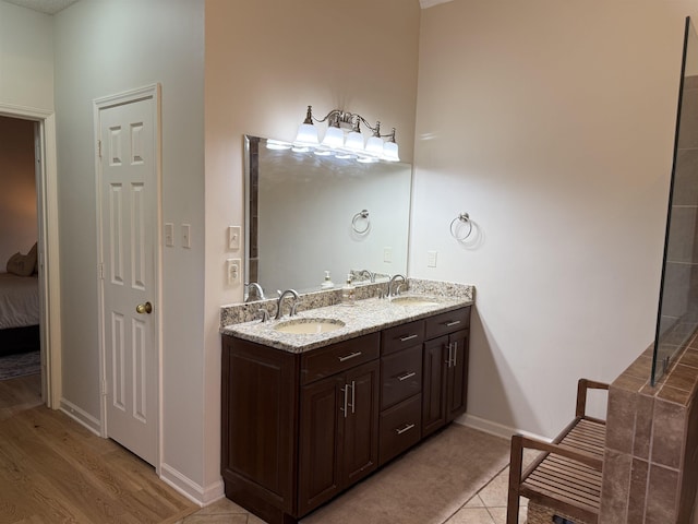 bathroom with wood-type flooring and vanity