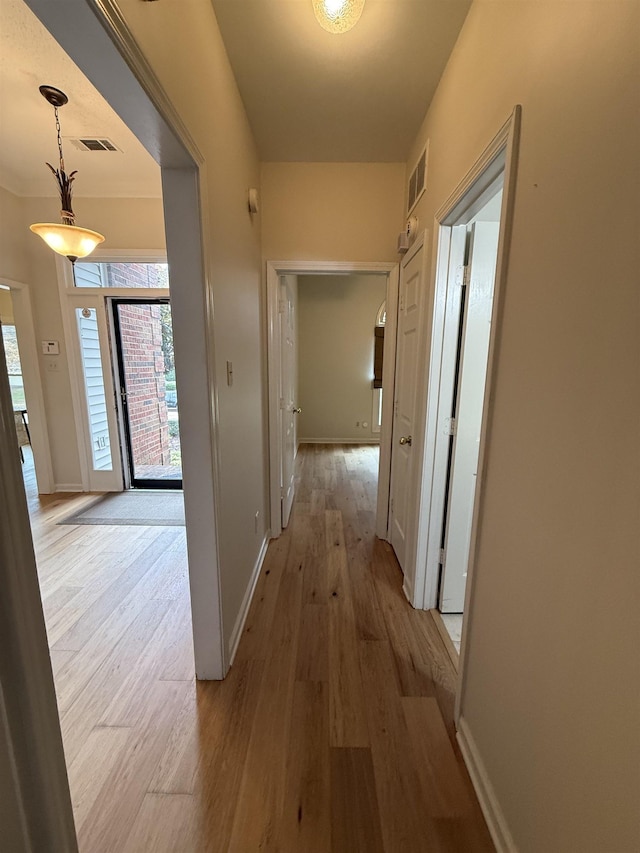 hallway featuring light wood-type flooring