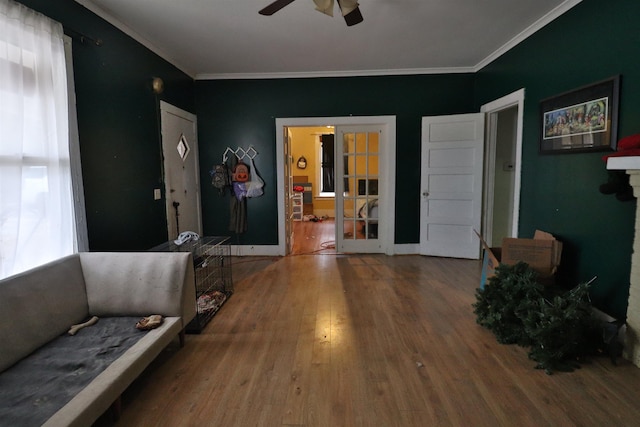 sitting room with hardwood / wood-style floors, plenty of natural light, ceiling fan, and french doors