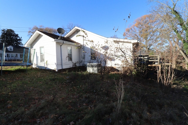 view of property exterior featuring a trampoline