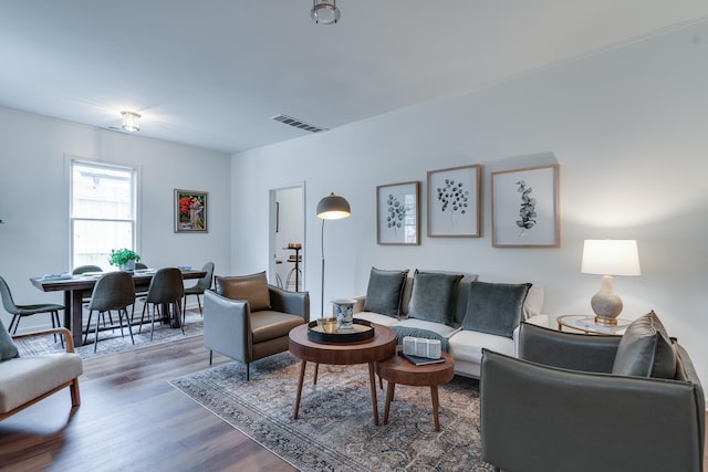 living room with dark hardwood / wood-style flooring