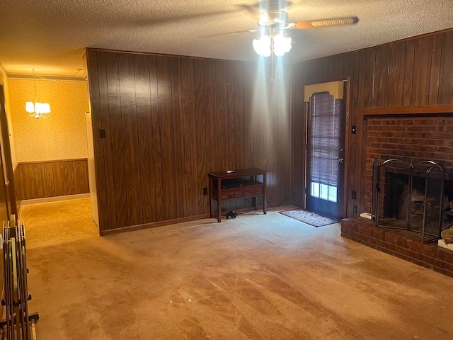 living room featuring a fireplace, a textured ceiling, and light colored carpet