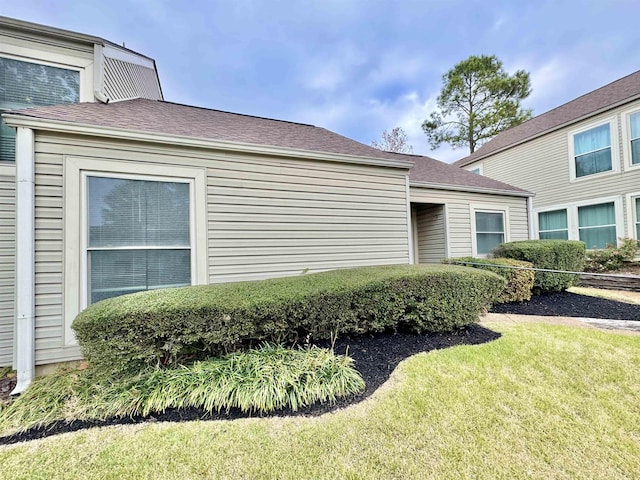 view of home's exterior featuring a lawn